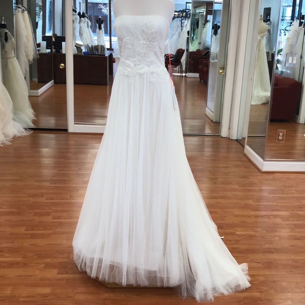 Ivory wedding gown with corset tie, sequins